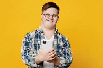 Young satisfied fun smiling man with down syndrome wears glasses casual clothes hold in hand use...