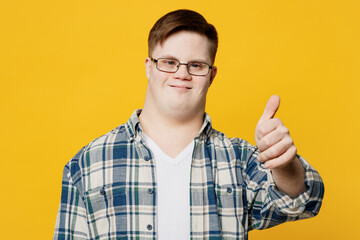 Young smiling cheerful fun positive man with down syndrome wearing glasses casual clothes look...