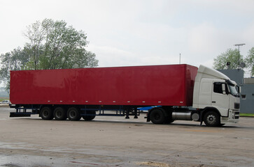 cargo truck with red canvas, ready to transport.