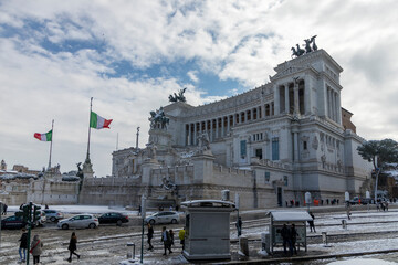 Altar of the Fatherland ("Altare della Patria") in Rome under the snow. Roman Piazza Venezia in Italy on a snowy day.