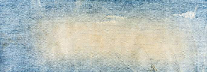 torn denim fashion jeans design texture. Blue denim jeans texture banner with copy space for text design background. Canvas denim fashion texture. Panoramic fashion banner