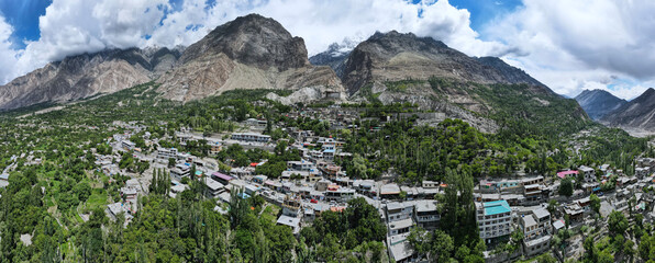 A 180 degree aerial panorama of mountains and VValley around the famous and historical Baltit Fort,...