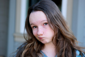 Nervous insecure young woman looking aside feeling fear uncertainty worried scared biting nails, stressed shy doubtful teen girl student anxious about problem isolated 