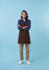 Full length young asian man barista bartender employee in apron work in coffee shop hold hands...