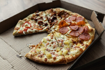 pizza slices in a cardboard box
