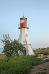 Fototapeta na wymiar A lighthouse on a hill