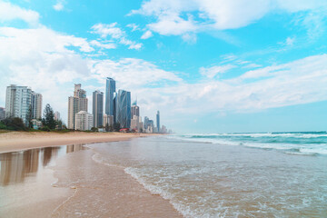 Spectacular panorama of the Gold Coast skyline and Surfers Paradise beach with rolling waves of Pacific ocean on a beautiful cloudy day.	
