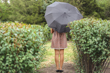 Girl with a black umbrellaм