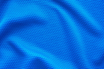 Blue football jersey clothing fabric texture sports wear background, close up top view