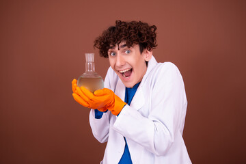 Crazy young scientist makes experiments in the office.