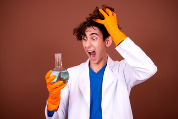 Crazy young scientist makes experiments in the office.
