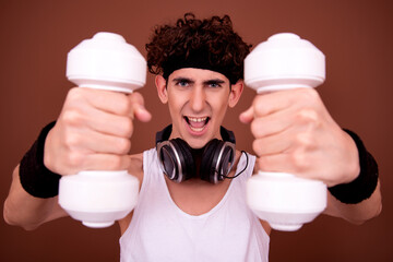 Retro style. A young attractive guy is doing aerobics.