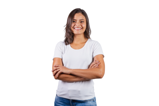beautiful brazilian woman with arms crossed. denim and white. optimistic, smiling.