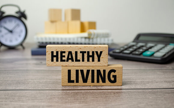 healthy living is shown on a conceptual photo using wooden blocks
