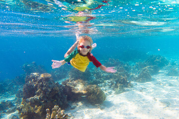 Naklejka premium Child snorkeling. Kids underwater. Beach and sea.