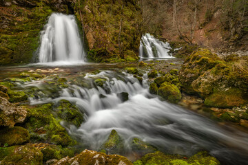 Fototapeta na wymiar Bohinj Bistrica waterfall and spring in north fresh Slovenia in nice forest