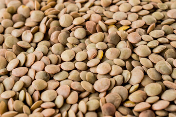 Some lentil grains as background filling the box
