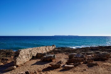Fototapeta na wymiar Blue sea at Cap de Ses Salines, Majorca
