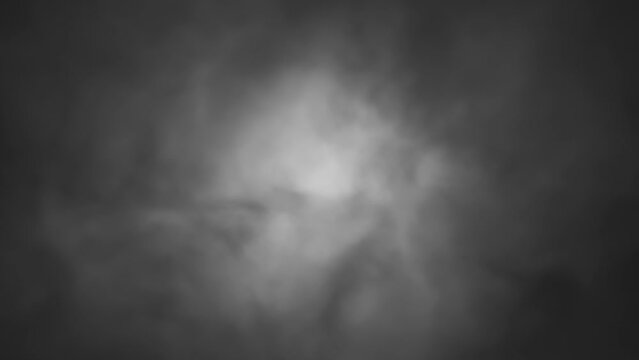 Turbulent white smoke moving from left to right on dark background