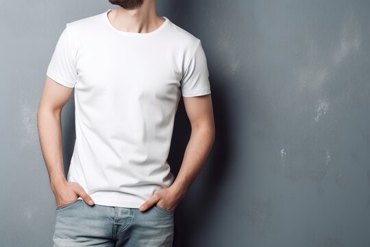 White t-shit mockup, unrecognizable young man standing against textured wall, wearing blank white tshirt. Generative AI