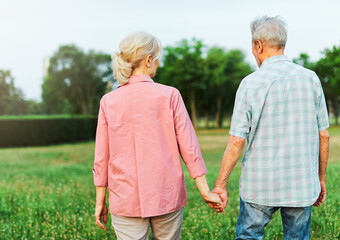 woman man outdoor senior couple retirement together walking love holding hands support old nature wife happiness mature elderly
