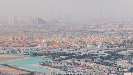 Aerial view of many apartment houses in Dubai city from above timelapse