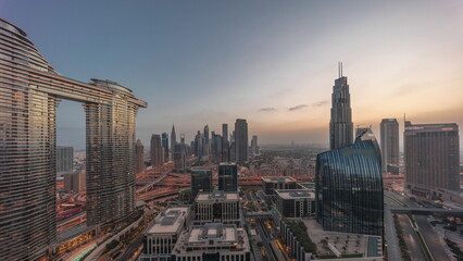 Futuristic Dubai Downtown and finansial district skyline aerial night to day timelapse.