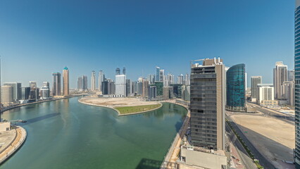 Obraz na płótnie Canvas Cityscape skyscrapers of Dubai Business Bay with water canal aerial timelapse.