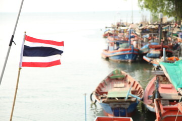 Thailand flag blur fishing boats background 