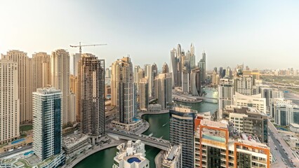Fototapeta na wymiar Panorama showing various skyscrapers in tallest recidential block in Dubai Marina aerial timelapse