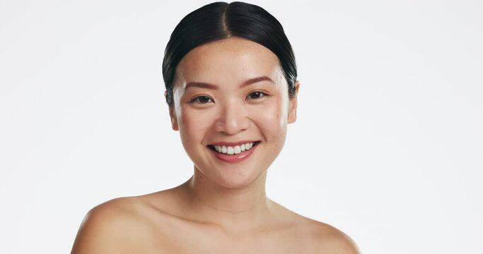 Skincare, asian woman and face of beauty, smile or happiness of laser results on white background. Happy model, studio portrait and aesthetic wellness of salon cosmetics, healthy shine or dermatology