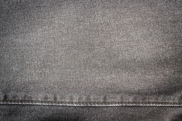 Dark jeans with stitch background