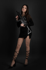 Fototapeta na wymiar Young Woman With Hand Gun