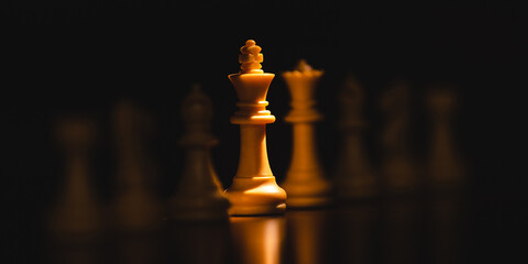 King chess pieces stand highlight leader with team concepts of challenge or business teamwork,...