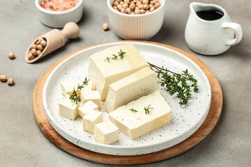 Tofu with bean on a light background, Culinary vegan and vegetarian eating, banner, menu, recipe place for text, top view