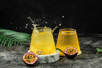 healthy drink glass of Iced passion fruit soda in a dark background, Tropical drink for summer party