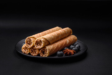 Delicious crispy wafer rolls with cream filling with nuts