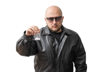 Dangerous bald man in black leather jacket and sunglasses holding plastic transparent bag with round white pills, drug dealer offering narcotics, isolated on transparent background