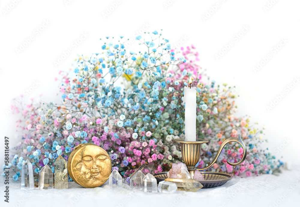 Poster moon amulet, clear crystals, candlestick and flowers on table close up, blurred light background. wi