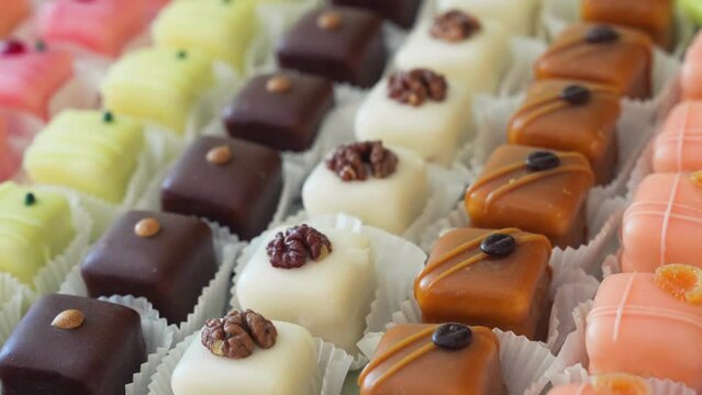 Small chocolate cakes. Colorful and delightful sweet cakes