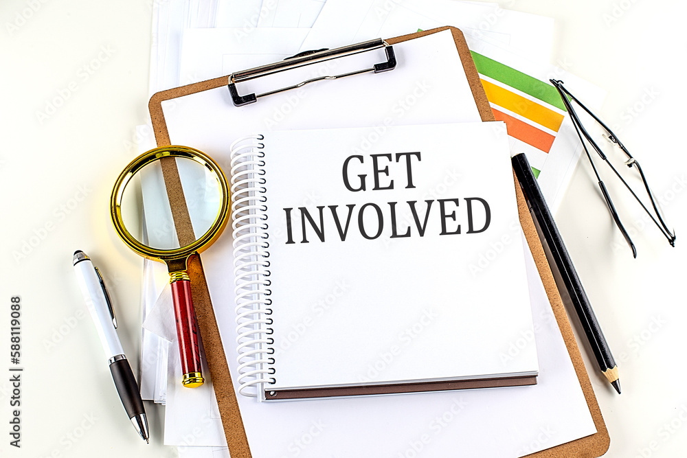 Aufkleber get involved text on notebook with clipboard on white background