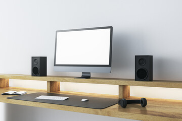 Modern wooden designer workplace with empty mock up computer screen, loud speakers and other items. 3D Rendering.
