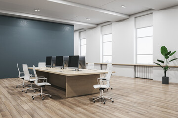 Modern concrete and wooden coworking office interior with furniture, equipment and window with daylight. 3D Rendering.