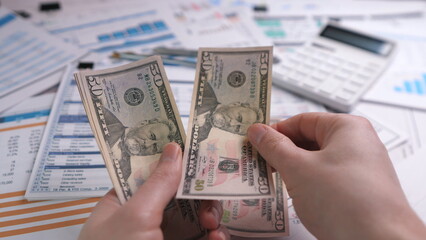 Hands counting dollars
