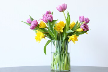 Tulips and narcissus in vase, home decor