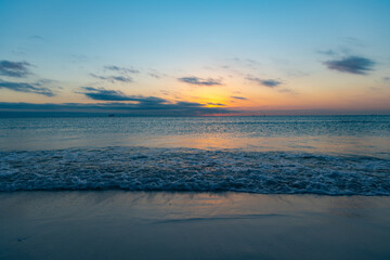 Fototapeta na wymiar beautiful twilight with sea water on the summer beach