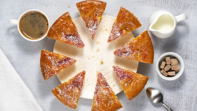 Eating cake bite by bite, stop motion. Plate of cake moving in the frame.