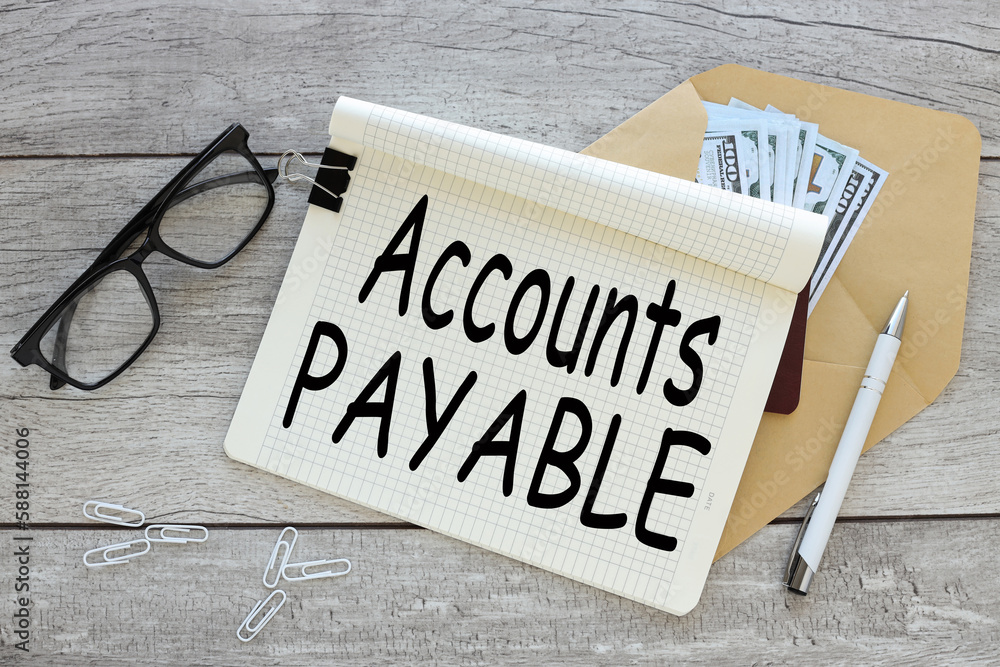 Poster accounts payable. business concept. open notepad with text on an envelope with money