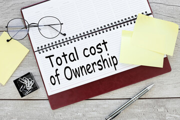 Total Cost of Ownership open diary with text on the pages