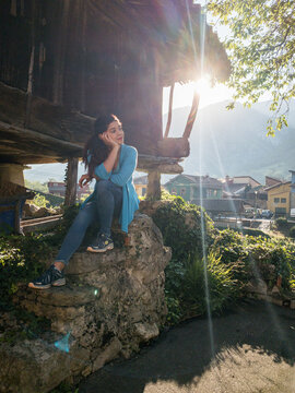 Asturian horreo rural tourism vacation. hispanic middle aged female relax and calm Wellbeing